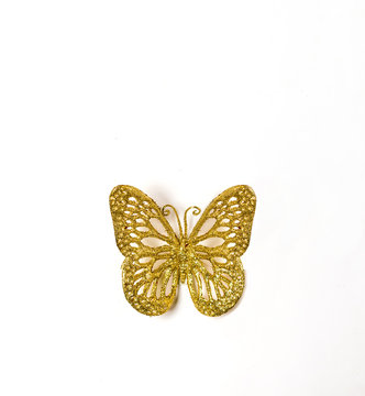 Gold Butterfly On A White Background.