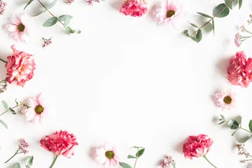  Flowers composition. Frame made of pink flowers and eucalyptus branches on white background. Valentines day, mothers day, womens day concept. Flat lay, top view © Flaffy