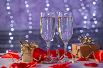 beautiful card with glasses of champagne hearts and a gift box for the feast of Valentine's Day in February