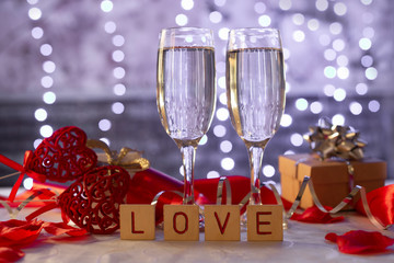  beautiful card with glasses of champagne hearts and a gift box for the feast of Valentine's Day in February