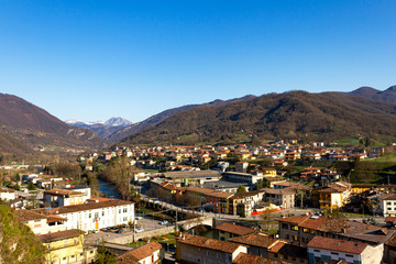 Fototapeta na wymiar Cityscape of a little Italian village between mountains