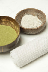 Making homemade green clay facial beauty mask