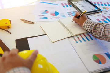 Architectural work site desk background construction project ideas concept, With drawing equipmen