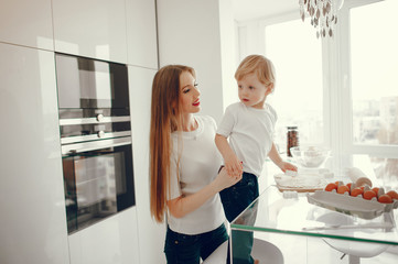 Family in a kitchen. Beautiful mother with little son