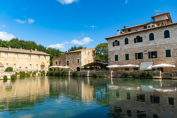 Fototapeta na wymiar Antique thermal baths in the medieval village Bagno Vignoni, Tuscany, Italy
