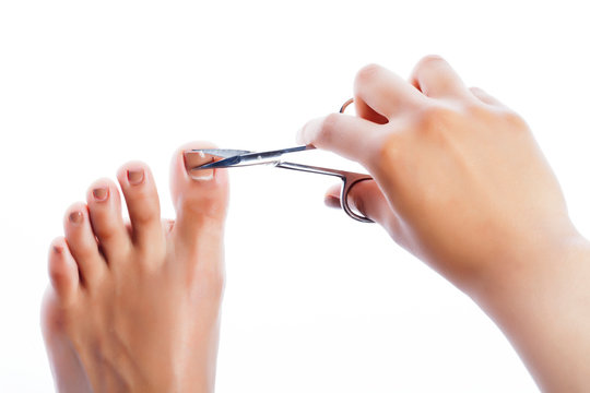 african taned hand doing manicure pedicure by itself isolated on white background