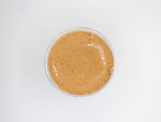 Aerial Shot Of A Brown Smoothie On A White Background