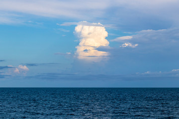 Naklejka na ściany i meble Clouds forming over the ocean
