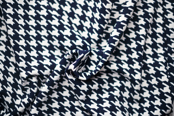 Fabric with goose foot pattern. Crumpled fabric background