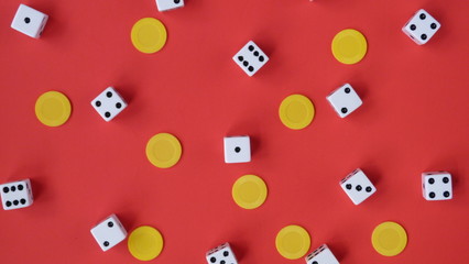 Flat Lay of Dice and Yellow Chips on a Red Background | Game Night