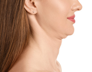 Young woman with double chin on white background