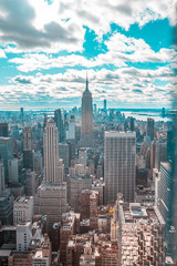 Fototapeta na wymiar New York, United States »; January 5, 2020: Top of the Rock in New York, the Empire State Building surrounded by skyscrapers