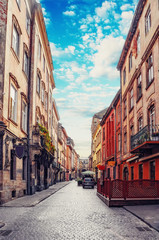 Beautiful view of the scene of an old street and historic houses with a paving road