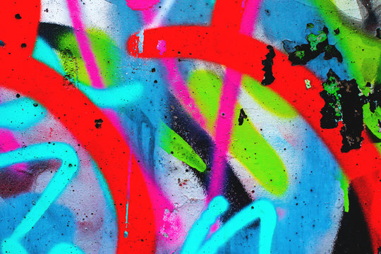 Fototapeta Closeup of colorful urban wall texture. Modern pattern for wallpaper design. Creative urban city background. Abstract open composition.