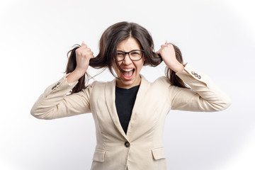 Stressed female office clerk in glasses screaming and pulling her hair isolated white background