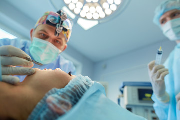 Man surgeon at work in operating room