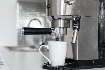 Close-up of making coffee in a coffee machine.