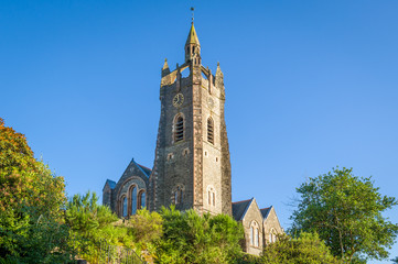 Parish Church tower on the hills of Tarbert. Landmarks of Scotland.