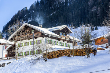 winter in mountains with lots of snow, bright blue sky