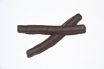 Orangette with dark chocolate on white background