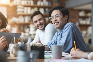 Close up of two guys attending regular business meeting