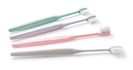 Different tooth brushes on white background