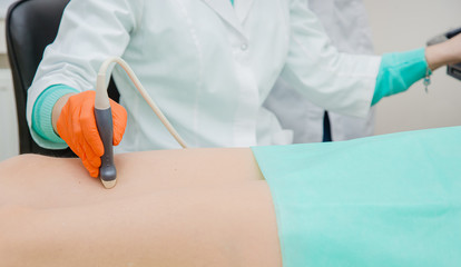 Ultrasound examination of leg veins. Ultrasound vessels at thigh, leg.