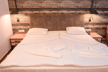 bed with white pillowcase and sheet