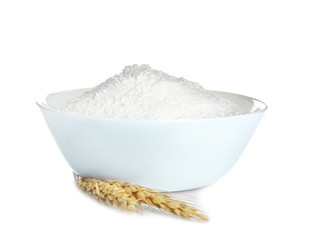 Bowl with flour on white background