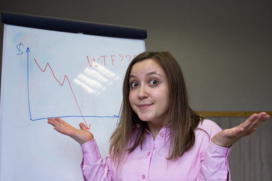 Shrugging woman in doubt doing shrug on office background with flipchart. business concept