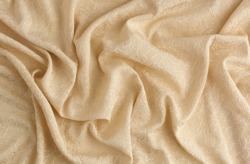 beige satin textile fabric with embroidery elements, piece of canvas for sewing curtains