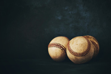 Baseball ball group close up isolated on dark background for sport game concept copy space.