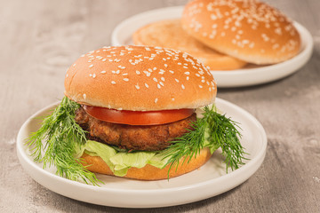 hamburger on a gray wooden table