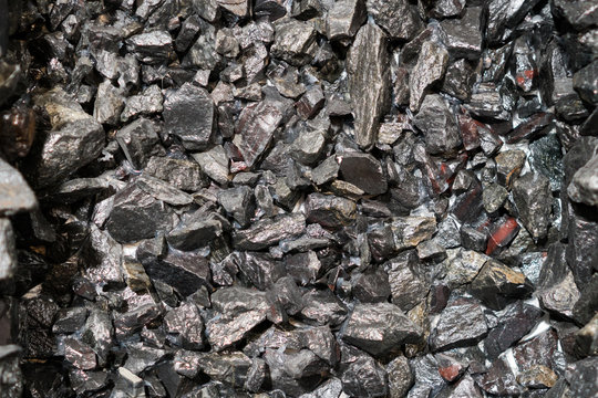 Close up view of the iron ore. rough Hematite, iron Kidney Ore stone. Pieces of ferrotitanium closeup. Close-up view of the iron stone