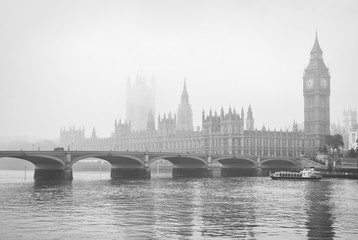 Monochrome misty view of Big Ben and the Houses of Parliament with Westminster Bridge, London, UK