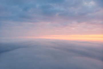 Drone fly above a cloudy sky