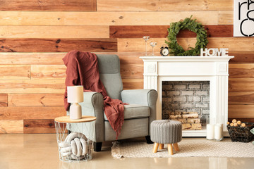 Interior of modern room with fireplace and Christmas decor