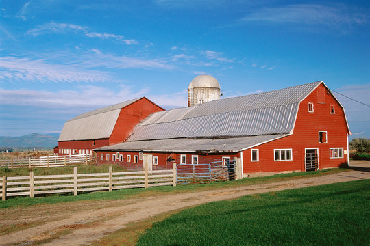 Red barn with silo beyond