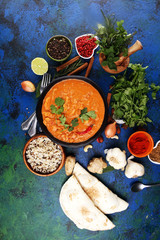 Chicken tikka masala spicy curry meat food in pot with rice and naan bread. indian food