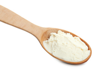 Fototapeta na wymiar Spoon with tasty cream cheese on white background