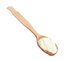 Spoon with tasty cream cheese on white background