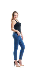 Girl posing in jeans in front of the camera