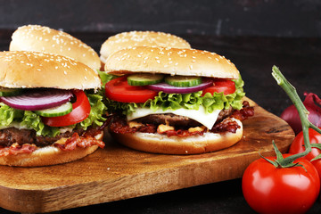 Tasty fresh meat burgers with salad and cheese. Homemade angus burger.
