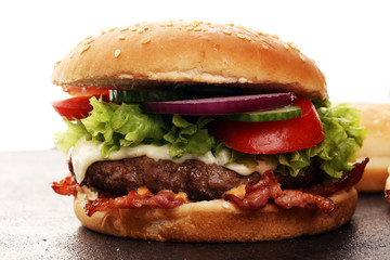 Tasty fresh meat burgers with salad and cheese. Homemade angus burger.