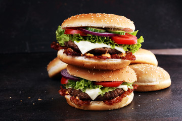 Tasty fresh meat burgers with salad and cheese. Homemade angus burger.