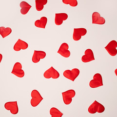 Valentine's Day. Many red hearts on a white background. Texture.