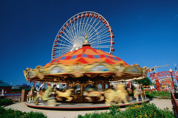 Carousel at amusement park in evening