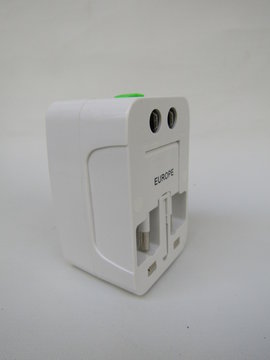 Travel Adaptor Adapter Universal EU AU UK US Plug with Port USB worldwide all in one isolated on white background for travelling equipment with casing and pouch. 
