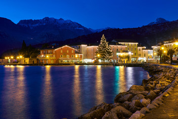 Christmas lights adorning the city center and Riva del Garda Street, View of the beautiful Riva del...