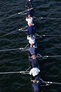 Crew Team Rowing On Water